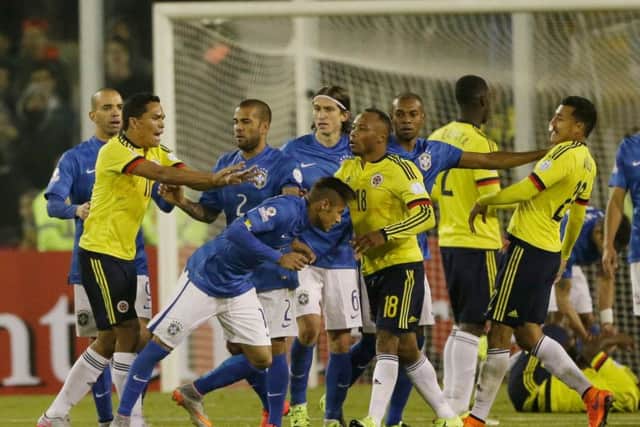 Colombias Carlos Bacca, second left, pushes Brazil striker Neymar at the end of the Copa America clash in Santiago. Bacca and Neymar were both sent off Picture: AP