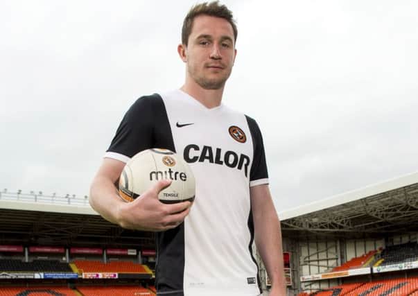 Dundee United's Callum Morris unveils his side's new away kit for the 2015/2016 season.