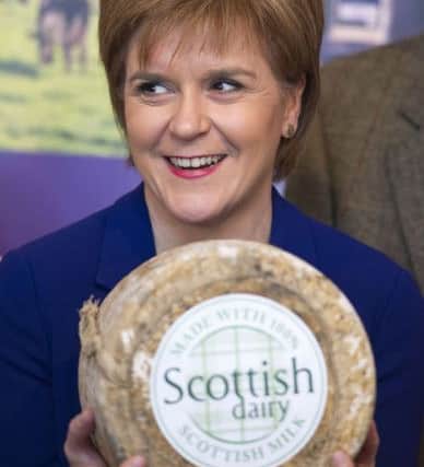 Nicola Sturgeon helps unveil a distinct new brand to help consumers identify Scottish dairy products. Picture: Ian Rutherford