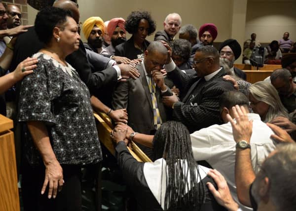 Mourners in another church grieve for the dead. Picture: AP