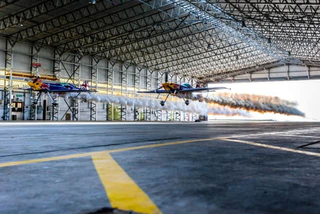 The two planes speed through the hangar at 185mph. Picture: PA