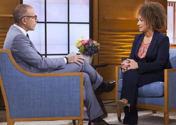 Rachel Dolezal, here being quizzed by Matt Lauer on the Today Show in the US, has faced condemnation but is it self-identifying as black so bad? Picture: AP