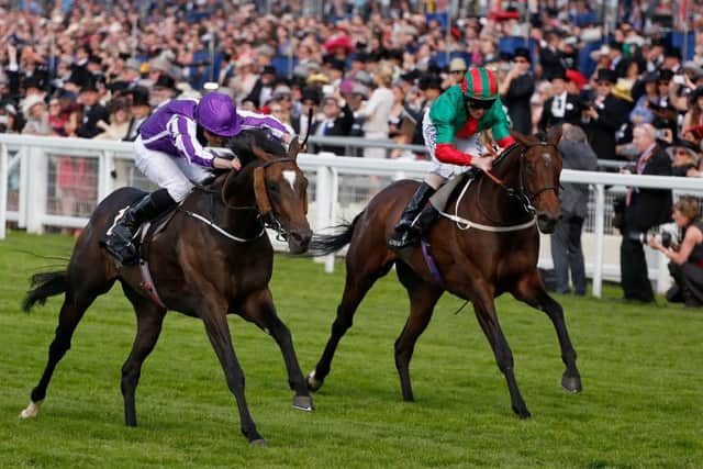 Ryan Moore powers Aloft home to win the Queens Vase, at Royal Ascot yesterday, his record-breaking ninth victory of the meeting. Picture: Getty Images