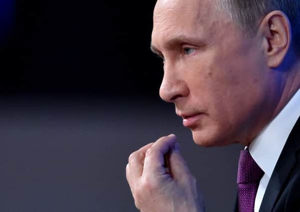 Russian President Vladimir Putin gestures as he speaks during his annual press conference in Moscow. Picture: Getty