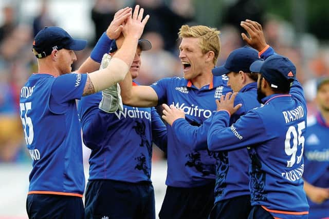 David Willey of England celebrates with teammates after dismissing Luke Ronchi of New Zealand. Picture: Getty