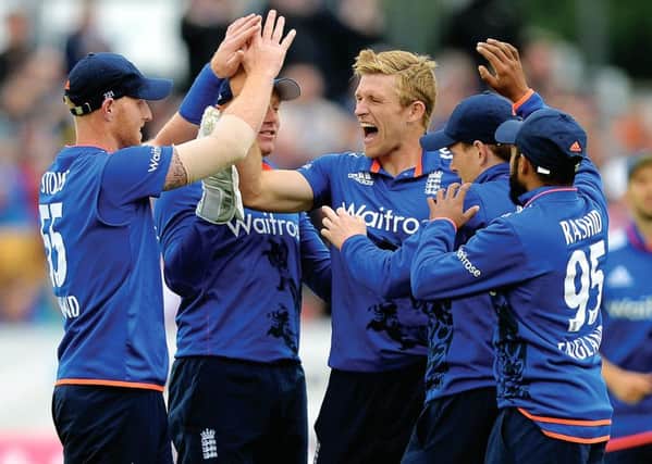 David Willey of England celebrates with teammates after dismissing Luke Ronchi of New Zealand. Picture: Getty