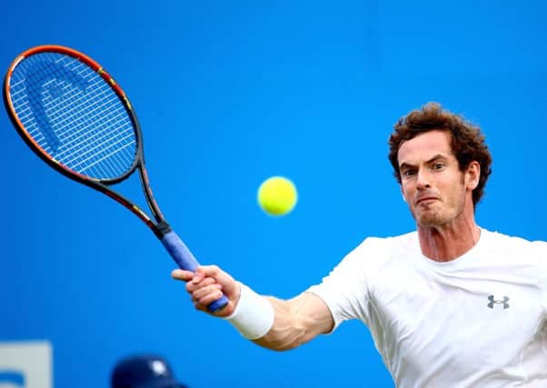 Andy Murray plays a forehand in his curtailed match against Viktor Troicki. Picture: Getty