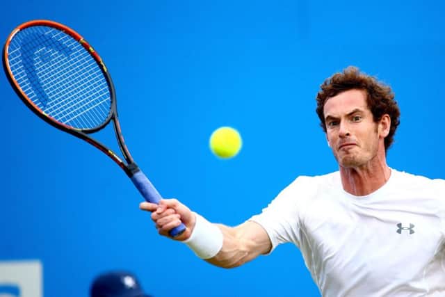 Andy Murray plays a forehand in his curtailed match against Viktor Troicki. Picture: Getty
