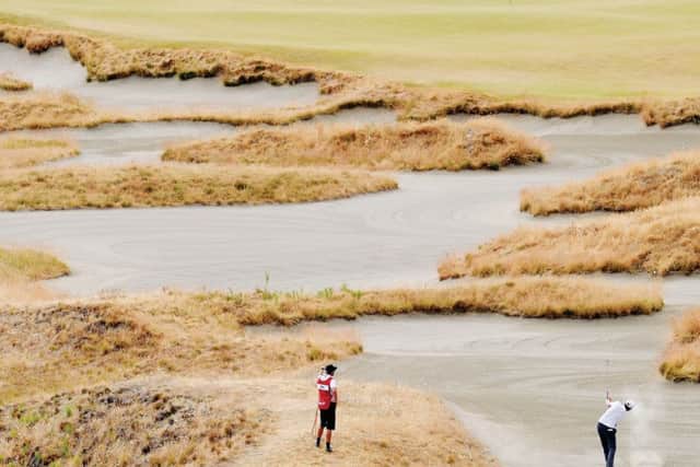 Jimmy Gunn plays a bunker shot on the 14th hole during the first round of the 115th U.S. Open Championship at Chambers Bay. Picture: Getty