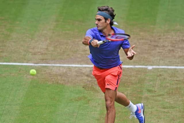 Roger Federer plays a forehand in his match against Ivo Karlovic of Croatia during day six of the Gerry Weber Open. Picture: Getty