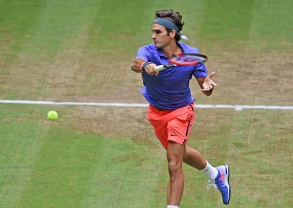 Roger Federer plays a forehand in his match against Ivo Karlovic of Croatia during day six of the Gerry Weber Open. Picture: Getty