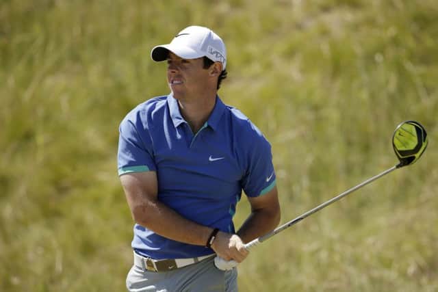 Rory McIlroy watches his tee shot at the 7th hole yesterday. Photograph: Getty