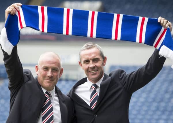 Mark Warburton, left, has been reunited with David Weir whom he worked with at Brentford. Photograph: PA
