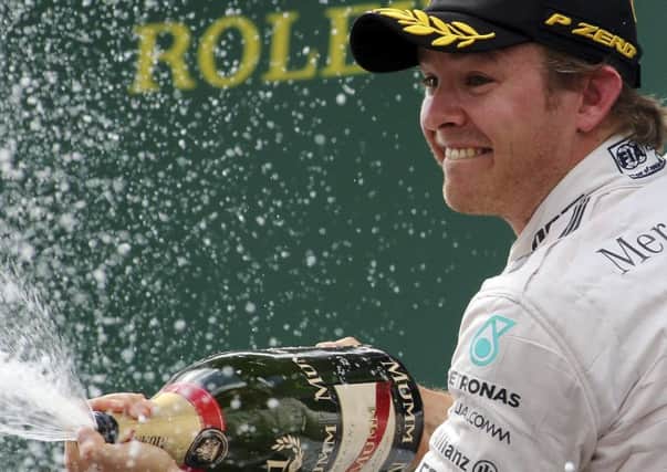 Mercedes driver Nico Rosberg celebrates his victory following the Austrian Formula One Grand Prix race in Spielberg. Picture: AP