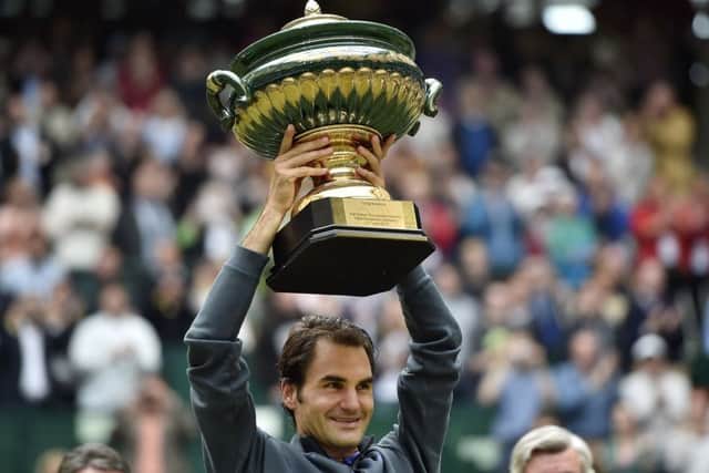 Roger Federer lifts the Gerry Weber Open trophy. Picture: Martin Meissner