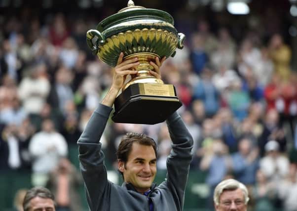 Roger Federer lifts the Gerry Weber Open trophy. Picture: Martin Meissner