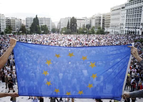 Pro-European Union protesters take part in a rally in front of the parliament in Athens, Greece. Picture: Getty