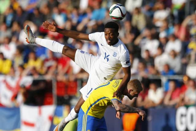 England midfielder Nathaniel Chalobah outjumps Swedish striker John Guidetti at the Ander Stadium in Olomouc. Picture: AP