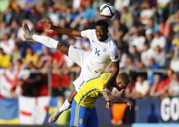 England midfielder Nathaniel Chalobah outjumps Swedish striker John Guidetti at the Ander Stadium in Olomouc. Picture: AP