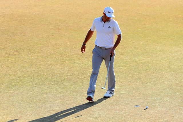 Dustin Johnson's three-putt on the 18th green handed the title to Spieth. Picture: Getty