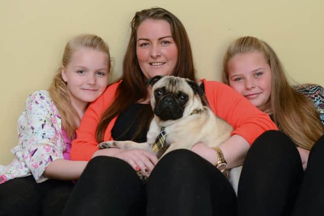 Leeanne Walker at home with her daughters Teigan, right, Kiara, and their pug, Prince. Picture: Neil Hanna