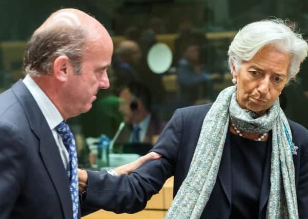 Spains Luis de Guindos at the summit yesterday with International Monetary Fund chief Christine Lagarde. Picture: AP