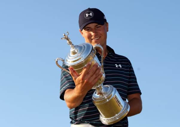 Jordan Spieth only has eyes for the US Open trophy after his dramatic win on Sunday. Picture: Getty Images