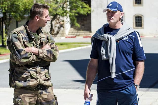 Head coach Vern Cotter speaks to a member of the French marines. Picture: SNS Group