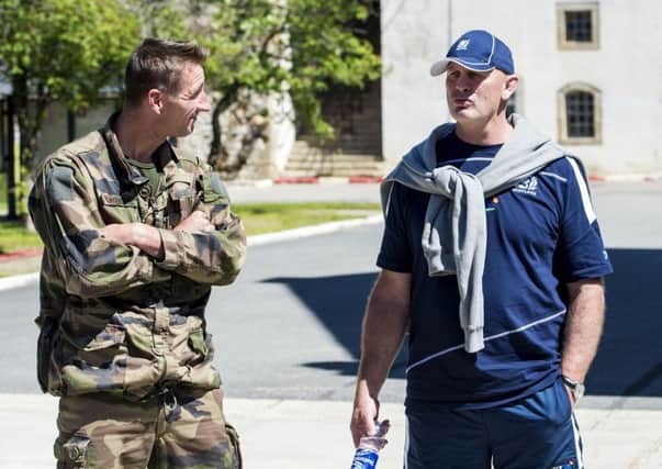 Head coach Vern Cotter speaks to a member of the French marines. Picture: SNS Group