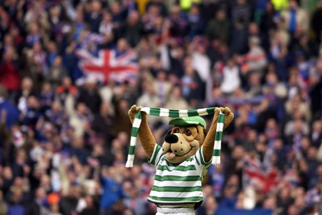 Hoopy the Huddle Hound celebrates a Celtic win over Rangers at Parkhead. Picture: TSPL