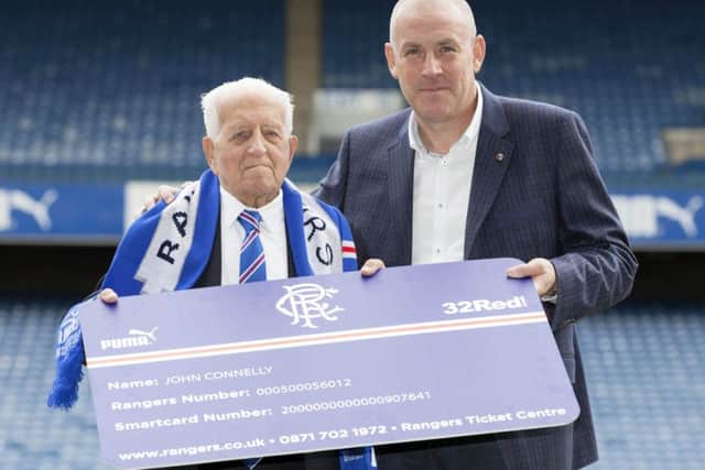 Mark Warburton, above, with lifelong Rangers fan John Connelly, who, at 100 years of age, has just renewed his season ticket. Picture: SNS Group