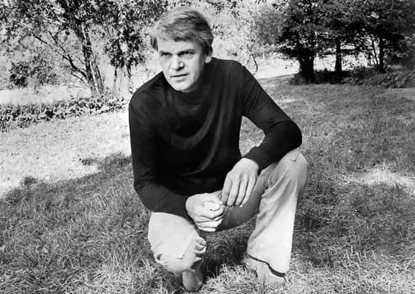 Milan Kundera poses in a garden in Prague in 1973. The Czech writer's latest novel is a slim volume with big ideas. Picture: Getty Images