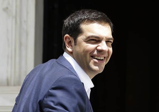 Vote on proposed cuts will strain Greece's Prime Minister Alexis Tsipras' ruling coalition. Picture: AP