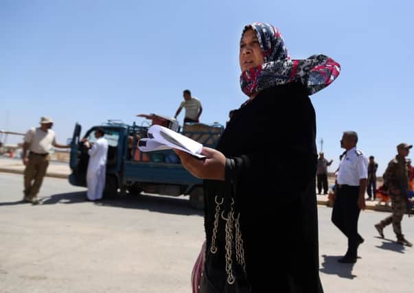 Civilians are trickling back into Saddam Husseins hometown as they look to start anew. Picture: AP
