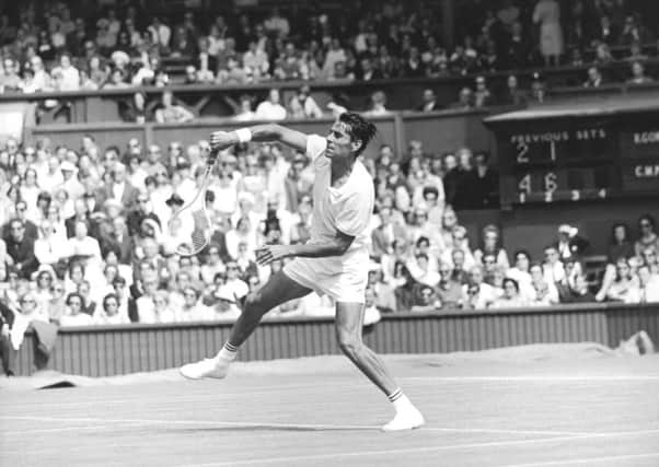 Pancho Gonzalez, pictured, and Charlie Pasarell played a record 112-game singles match at Wimbledon in 1969. Picture: Getty Images