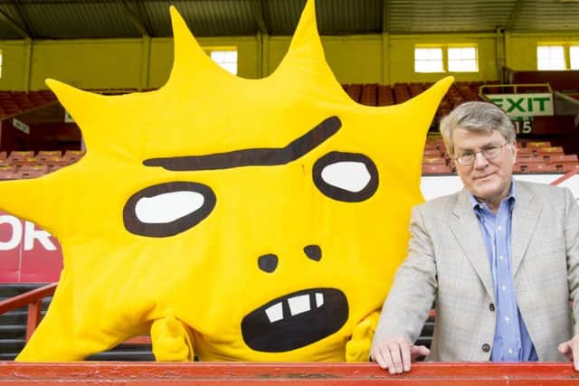 Managing member of Kingsford Capital Mike Wilkins joins new mascot Kingsley. Picture: SNS