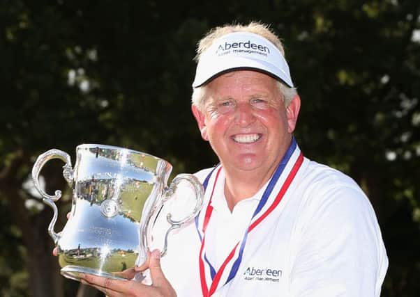 Colin Montgomerie poses with the trophy after winning the US Seniors Open last year. Picture: Getty