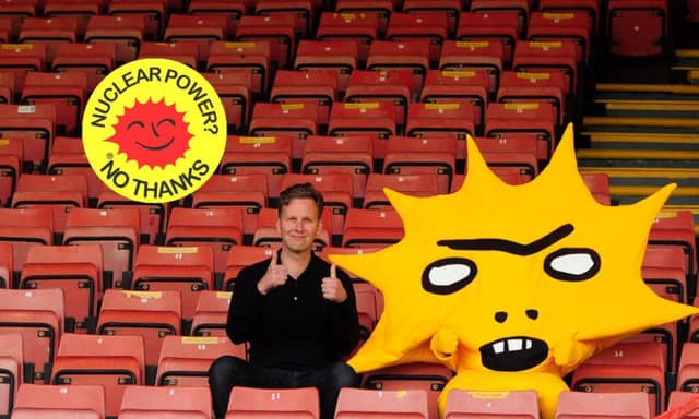 David Shrigley with Kingsley, right, and the anti-nuclear symbol that environmental activists claim the artist has copied. Picture: Hemedia/OOA Fonden