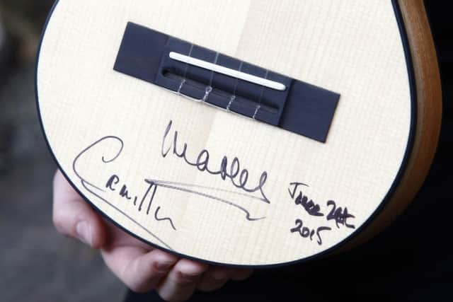 Scott Hutchison's ukulele signed by The Duke and Duchess of Rothesay during a visit to the refurbished Clutha bar. Picture: Getty