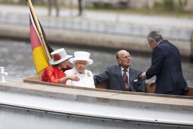German President Joachim Gauck, right, and his partner Daniela Schadt, left, travel by boat along the River Spree in Berlin with Queen Elizabeth II and the Duke of Edinburgh. Picture: PA