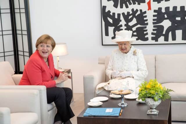 German Chancellor Angela Merkel and Queen Elizabeth II speak during their meeting at the Federal Chancellery. Picture: Getty Images