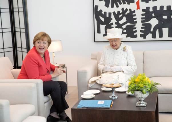 German Chancellor Angela Merkel and Queen Elizabeth II speak during their meeting at the Federal Chancellery. Picture: Getty Images