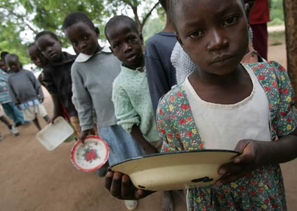 Zimbabwean children wait for food at a primary school. Picture: AFP