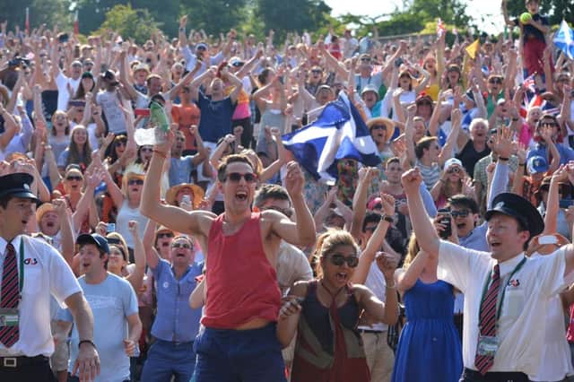 Fans celebrate on Murray Mount after Andy Murray beats Serbia's Novak Djokovic in the 2013 men's singles final at Wimbledon. Picture: Getty