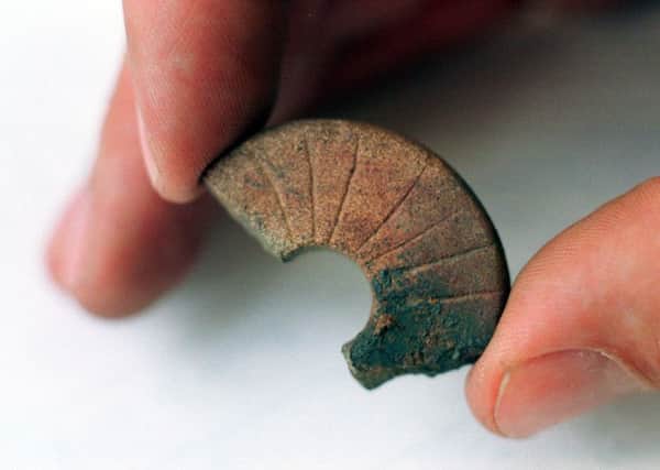 An example of a broken Viking spindle whorl, found at a previous dig in Scotland. Picture: TSPL