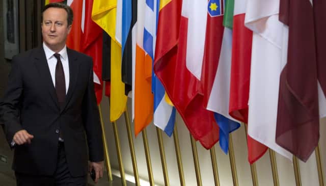 Prime Minister David Cameron leaves after an EU summit in Brussels yesterday. Picture: AP