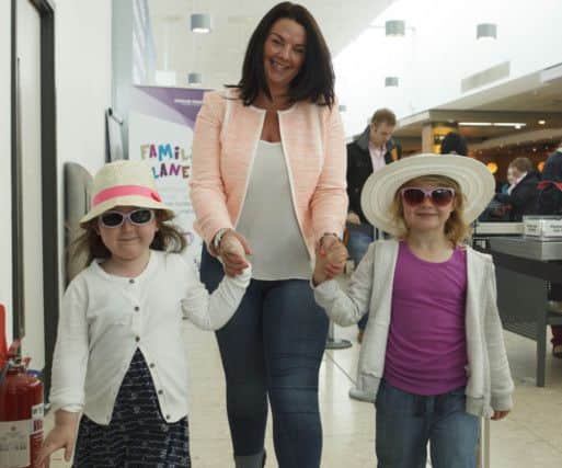 Taylor Crozier, Charlene Wilson and Eva Wilson in the family lane at Edinburgh Airport. Picture: Toby Williams
