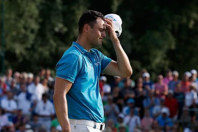 Martin Kaymer shows his dejection as he walks off the 18th green at the Eichenried Golf Club. Picture: Getty