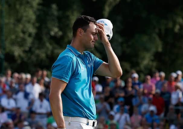 Martin Kaymer shows his dejection as he walks off the 18th green at the Eichenried Golf Club. Picture: Getty