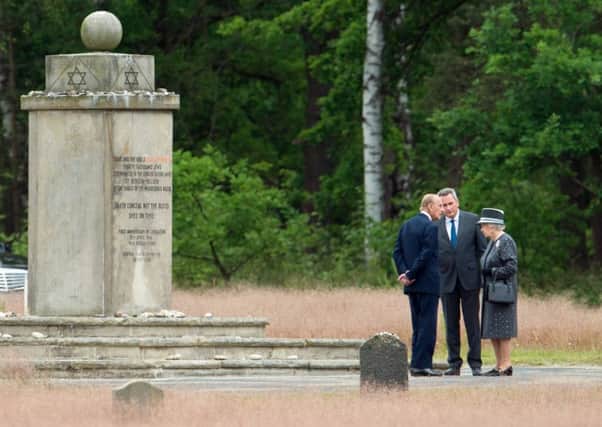 The Queen and Duke of Edinburgh pay their respects at the site of BergenBelsen. Picture: Getty